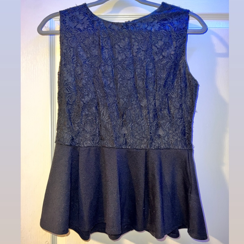 wide strap tank top shirt. flower like pattern on the top half